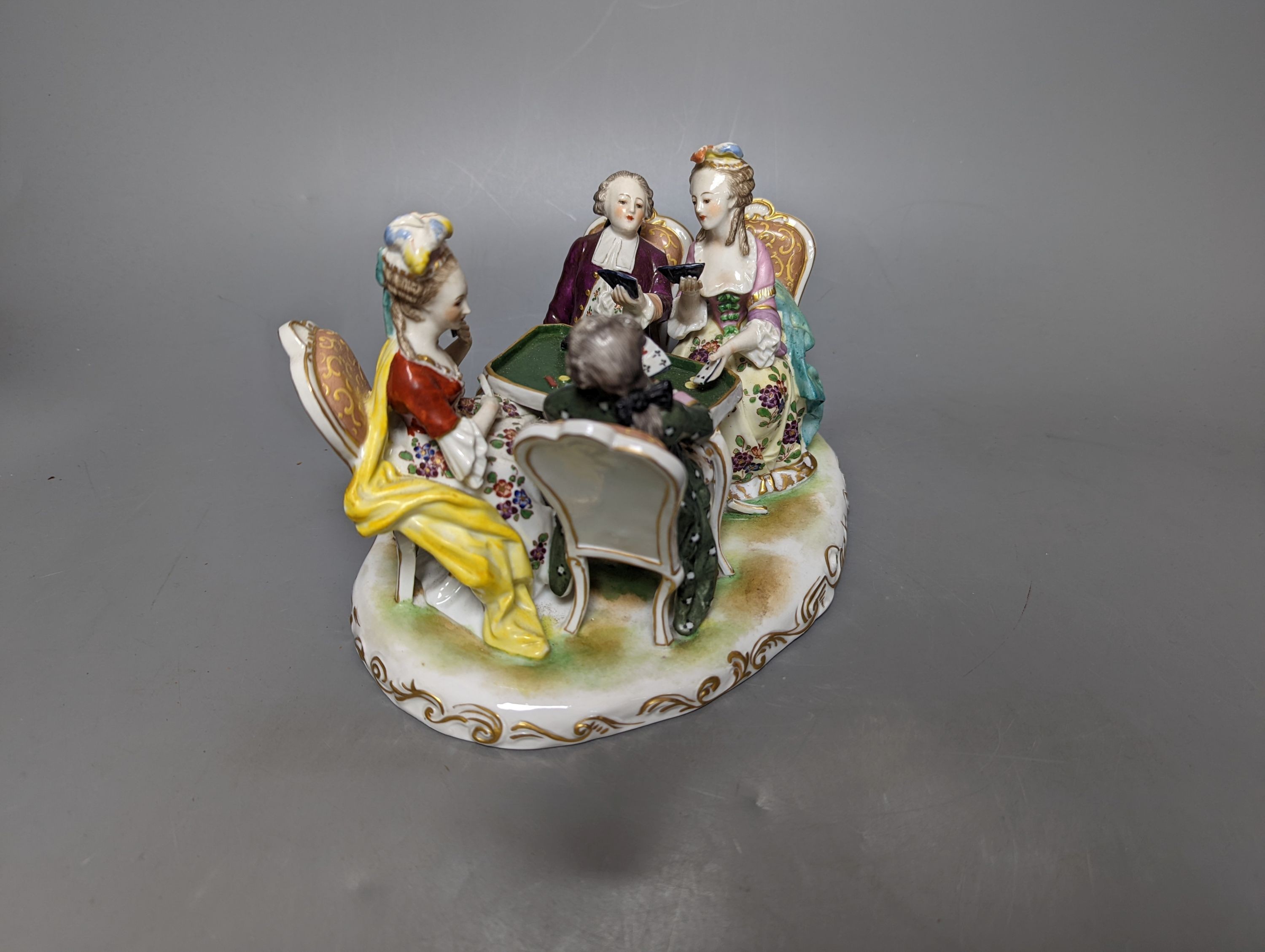 A German porcelain group of figures at a games table 21cm